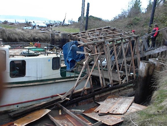 Boat in the slip alongside the dismantled boathouse