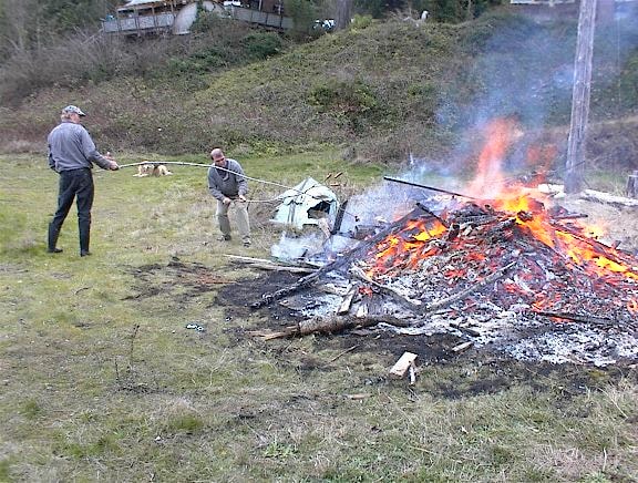 Burning debris pile during boathouse cleanup